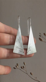 Load and play video in Gallery viewer, Long triangle earrings in silver with asymmetrical branch cut out    (made to order)
