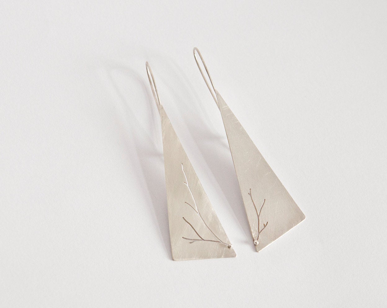 Long triangle earrings in silver with asymmetrical branch cut out    (made to order)