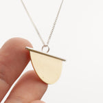 Load image into Gallery viewer, Pendant in brass and silver ~ brass half circle on silver line    (made to order)
