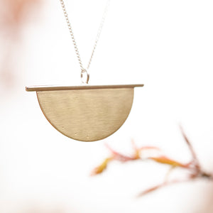 Pendant in brass and silver ~ brass half circle on silver line    (made to order)