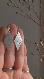 Load and play video in Gallery viewer, Dangling earrings in silver with cut out branch    (made to order)
