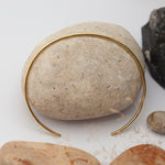Load image into Gallery viewer, Simple brass cuff with hammered center ~ D shaped band   (Made to order)
