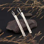 Load image into Gallery viewer, Long silver earrings with branch cut out    (made to order)
