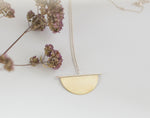 Lade das Bild in den Galerie-Viewer, Pendant in brass and silver ~ brass half circle on silver line    (made to order)
