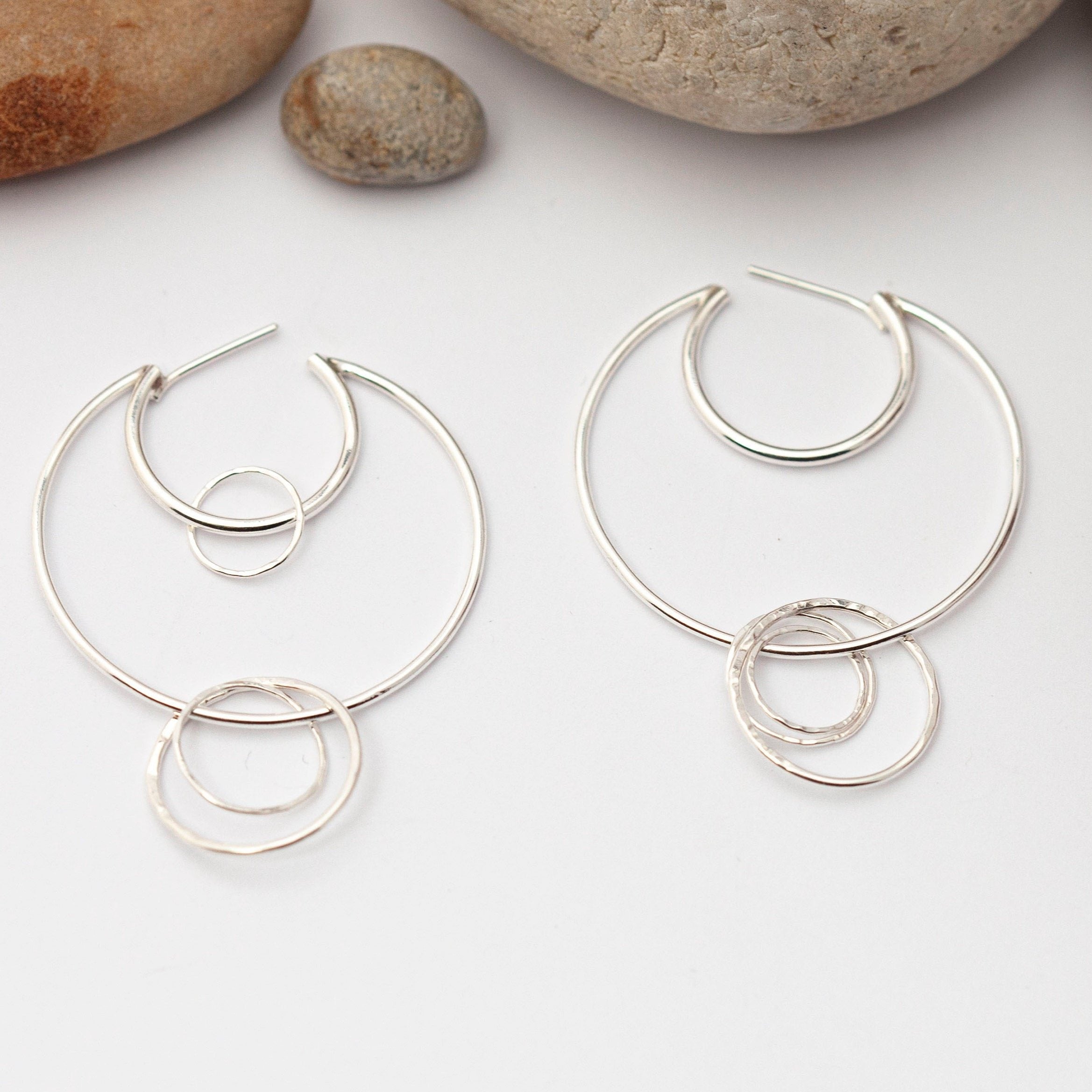 Crescent moon hoop earrings in silver ~ many rings with hammered texture    (made to order)